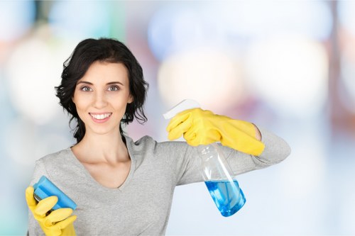 Local cleaner treating sofa stains in a Roehampton property